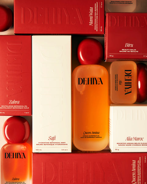 Flay lay DEHIYA products and boxes in red, cream, and orange tones