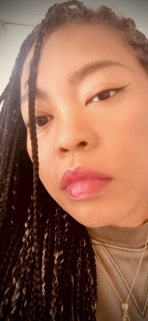 Picture of black woman with braids with pink lip