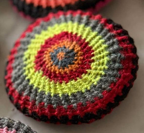 Colorful crocheted Mihakka Jouj with circular design